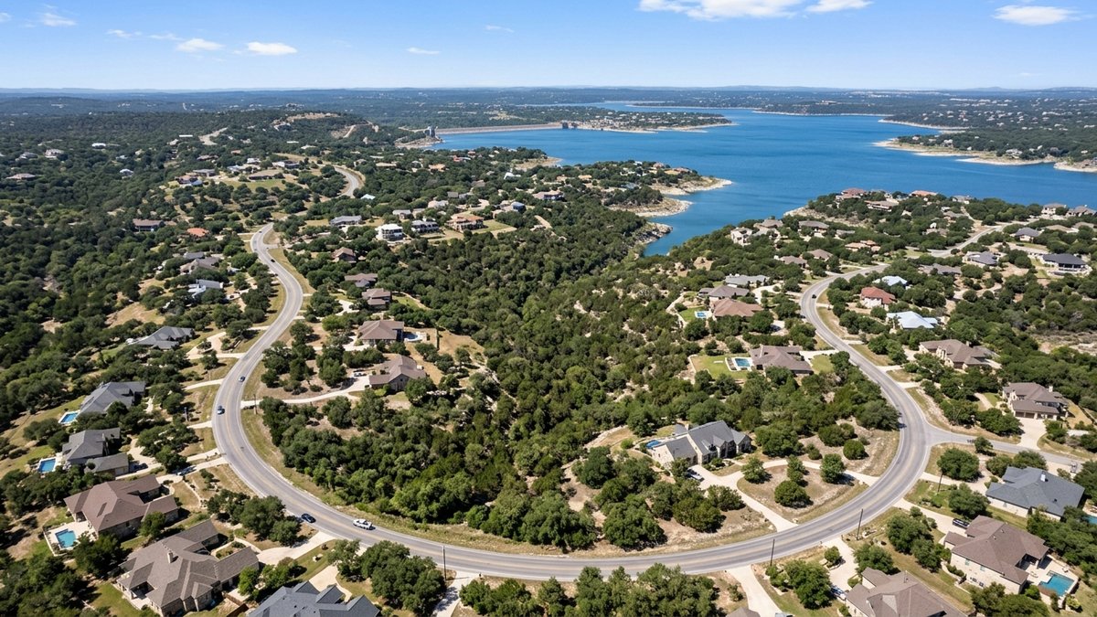 Natural daytime aerial of Canyon Lake-area homes and Hill Country terrain. Used for market and neighborhood overview posts.
