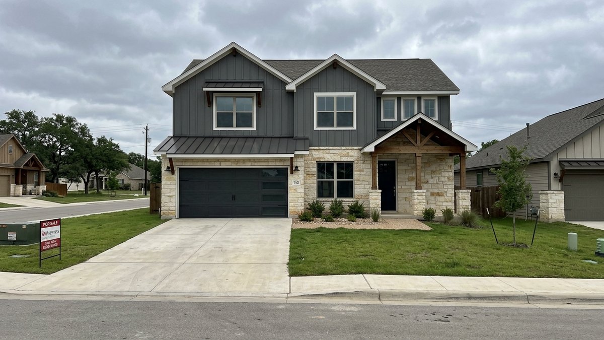 Two-story modern farmhouse home in a New Braunfels neighborhood, mid-day natural daylight, real estate listing photo style.